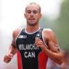 PARIS, FRANCE - JULY 31: Tyler Mislawchuk of Team Canada competes during Men's Individual Triathlon on day five of the Olympic Games Paris 2024 at Pont Alexandre III on July 31, 2024 in Paris, France. (Photo by Lars Baron/Getty Images)