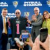 MIAMI, FLORIDA - AUGUST 06: Scott Carr, Pitbull, Kenneth Jessell, and Lucy Benedetti pose during the FIU Pitbull Stadium announcement at Tamiami Hall at Florida International University on August 06, 2024 in Miami, Florida. (Photo by Ivan Apfel/Getty Images)